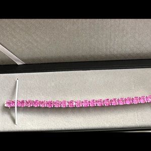 Pink created stones tennis bracelet.